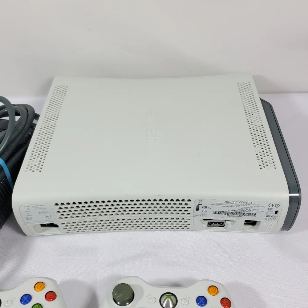 Xbox 360 with 4 games, 2 Controllers Tested Excellent.Condition is Excellent,